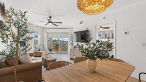 a living room with a table and chairs at August Beach Escape Special Rates Available! in St. Pete Beach
