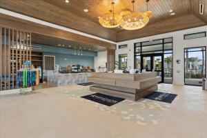 a lobby of a store with a counter and glass doors at 16159Coastal in Clermont