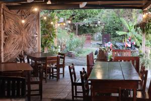 a restaurant with tables and chairs and a patio at Rancho Morgan in San Lázaro +87 photos