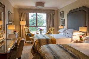 a hotel room with two beds and a window at St Helens Hotel, Dublin in Stillorgan +55 photos
