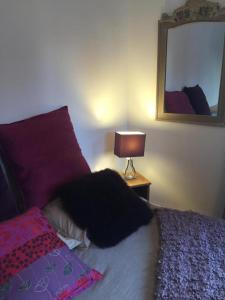 a dog laying on a bed in a bedroom at Studio Girofle dans Maison d'hôtes L'écrin des Saveurs in Schwenheim