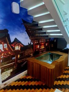 a building with a swimming pool in the middle at Nihon Cápsula Hotel in Florianópolis