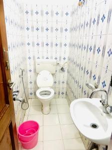 a bathroom with a toilet and a sink at Angel paradise in Jaipur +18 photos