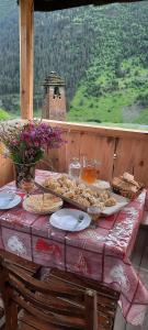 a table with a plate of food on it at Dartlo Hotel in Dart'lo