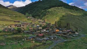 a village on a hill in the mountains at Dartlo Hotel in Dart'lo