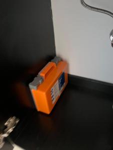 an orange box sitting on top of a table at Studio Apartment with backyard - All Private! in Homestead