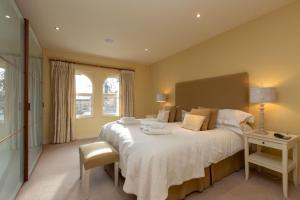 a bedroom with a large bed and a window at Underscar - Luxury 1 Bed Apartment in Applethwaite +20 photos