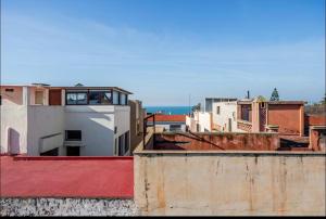 a view of a city from the roofs of buildings at Villa à harhora in Temara +1 photo