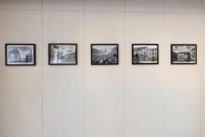 a group of framed pictures on a white wall at Albergo Ristorante Brera in Inveruno
