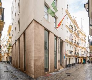 a street in the city with buildings at BYPILLOW Tiento in Cádiz