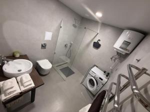 a bathroom with a shower and a toilet and a sink at Urban Nest in Truskavets +18 photos