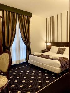 a hotel room with a bed and a window at Antica Stazione in Chiaramonte Gulfi +96 photos