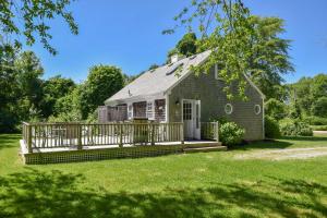 a house with a large deck in the yard at Huge Deck Outdoor Shower Dog Friendly in Brewster