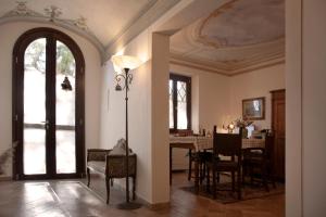 a dining room with a dining table and a ceiling at Il Casale Naturart in Quarrata