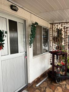 a door to a house with a table next to it at Apartamento Tito in Barra del Chuy