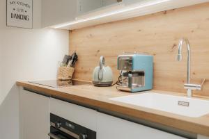a kitchen counter with a coffee maker on it at Stilvoll und ruhig in Füssen