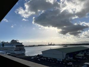 a cruise ship is docked in a harbor at Oasis du 7e ciel in Pointe-à-Pitre +4 photos