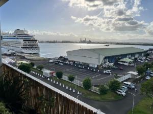 a cruise ship parked in a parking lot next to the water at Oasis du 7e ciel in Pointe-à-Pitre