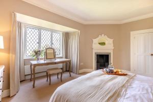 a bedroom with a bed and a desk and a mirror at 2 Bed in Ludlow oc-p31882 in Ludlow