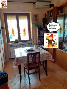 a kitchen with a table with a christmas sign on it at Room country-lake in Dormelletto