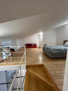 a loft bedroom with a bed and a desk and a bed at Villa Laura in Cefalù +25 photos