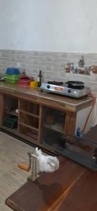a wooden table with a stove on top of it at Home mr in Matara