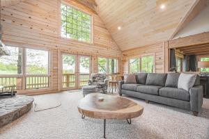 a living room with a couch and a coffee table at Alpine Adventure in McHenry +39 photos