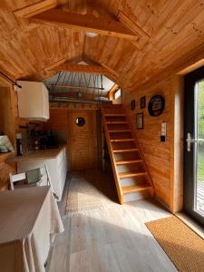 a room with a staircase in a tiny house at Tiny House na pevnosti Křelov in Olomouc