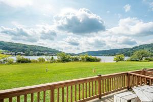 a deck with a view of a field and a lake at Ski Harbor 14 in McHenry
