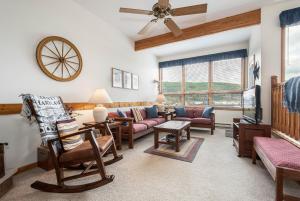 a living room with furniture and a ceiling fan at Ski Harbor 14 in McHenry +16 photos