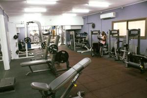 a woman in a gym with a woman in a wheelchair at Layla Glamping in Nir Dawid