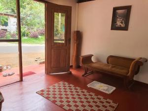 a living room with a couch and a door at Lulu s dream cafe in Welata