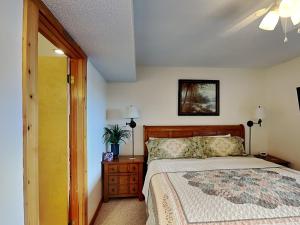 a bedroom with a bed and a ceiling fan at Sunplace 02 in McHenry +12 photos