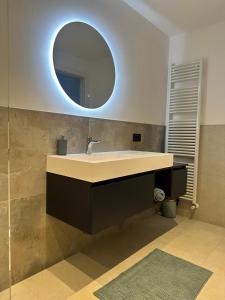 a bathroom with a sink and a mirror at Casa L'Oliver in Limone sul Garda +23 photos
