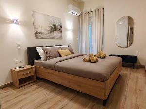 a bedroom with a large bed in a room at Your Inn in Tríkala