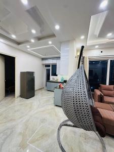 a living room with a couch and a chair in it at Dream heaven in Greater Noida