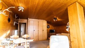 a room with wooden walls and a wooden ceiling at Haus Chämihitta, Riederalp Moosfluh in Riederalp