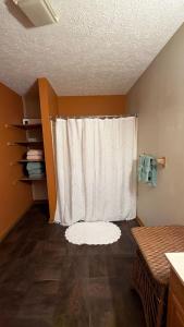 a room with a window with a white curtain at Comfortable 2BR-2BA Mountain Getaway Near Slopes in Cortland