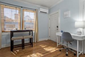 a home office with a desk and a chair at Honeymoon Suite with Shared POOL in Bay Saint Louis