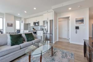 a living room with a couch and a glass table at Private Apt Downtown in Quincy +5 photos