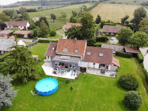 an aerial view of a house with a swimming pool at Murmure de Tilleul in Alembon