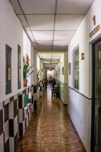 an empty hallway in an office building at Hotel Pablo Tesák in San Vicente