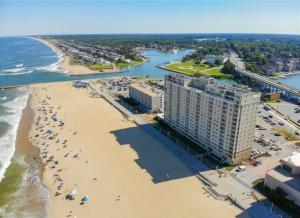an aerial view of a beach with a large building at Oceanfront Beach Condo, Pool, Gym, Fishing Surfing in Virginia Beach