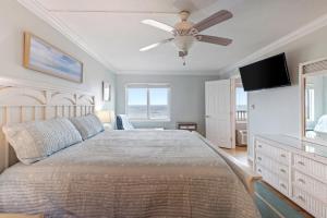 a bedroom with a bed and a ceiling fan at Oceanfront Condo, Heated Pool, Fitness Center in Virginia Beach +27 photos