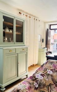 a living room with a couch and a large cabinet at Casa dei nonni in Rigali