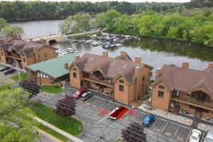 an aerial view of a large building with a marina at The Wanderlust at the Sunset Cove in Wisconsin Dells