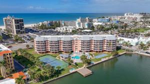 an aerial view of a resort near the ocean at Sunrise Resort 210 in St. Pete Beach