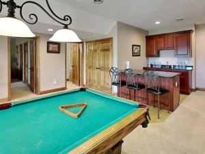 a pool table in the middle of a living room at Paravel in Swanton
