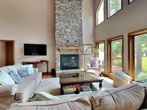 a living room with two couches and a fireplace at Paravel in Swanton +61 photos