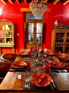 a dining room table with plates of food on it at Posada de la cruz#3 in Querétaro